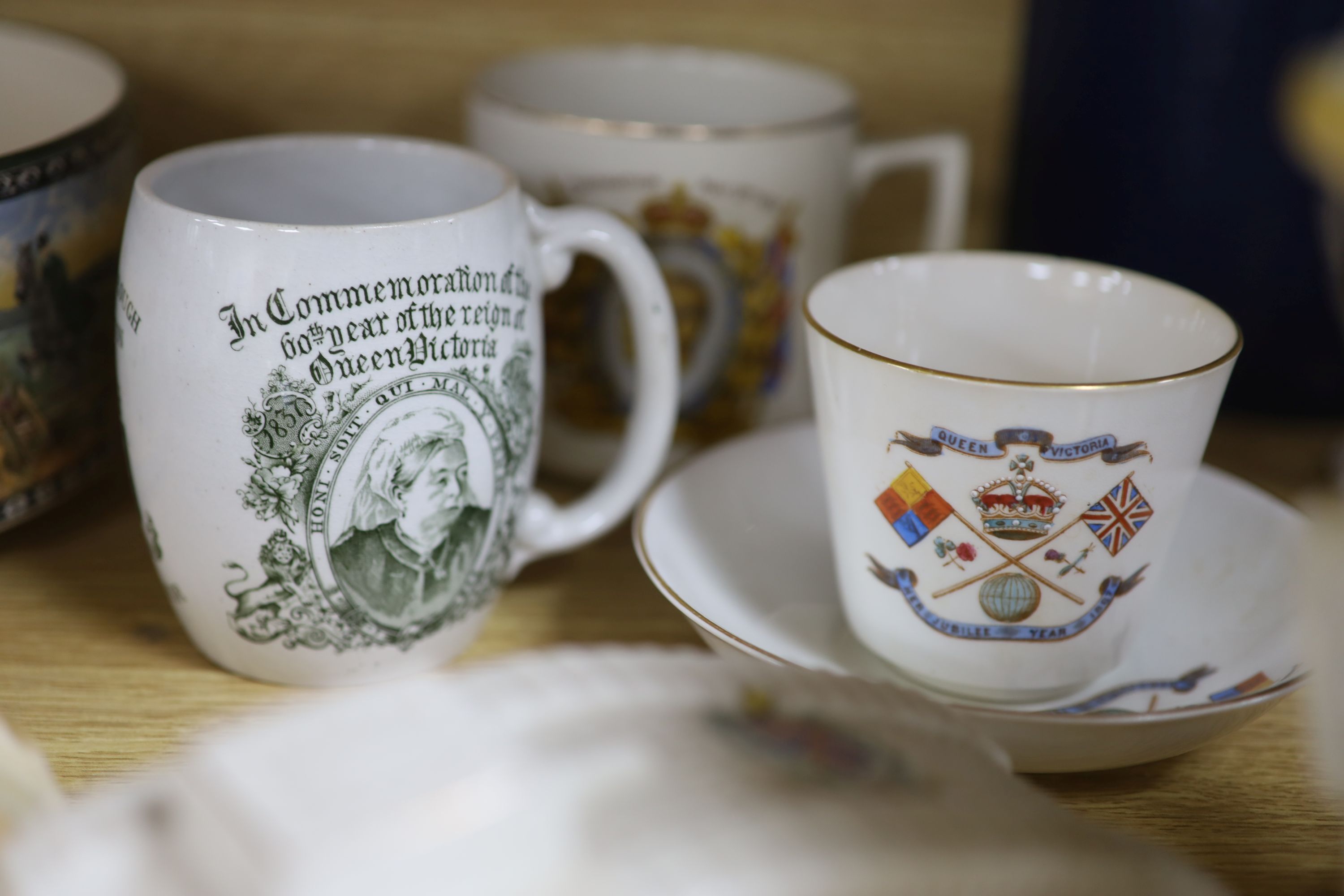 A quantity of mixed ceramics including commemorative wares, a Kitchener jug, Royal Doulton, etc.